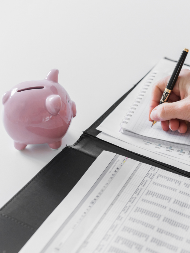 Calculator and business documents, representing Business Owner's Policy cost factors.